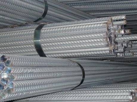 Galvanized reinforcing ribbed bars with steel strips packaged in warehouse.